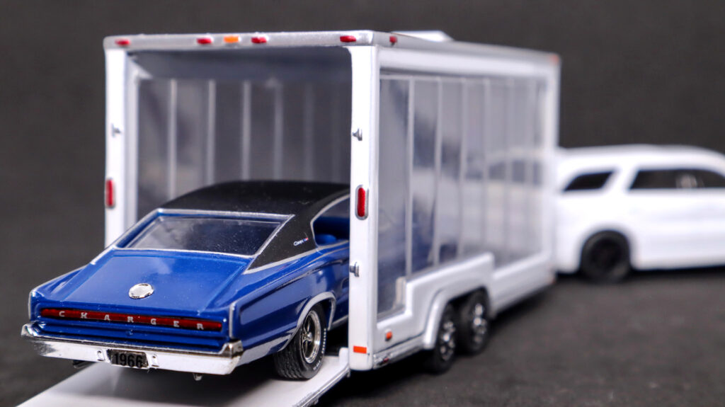 Greenlight glass trailer from Dodge Durango Hitch N Tow model with diecast car in it