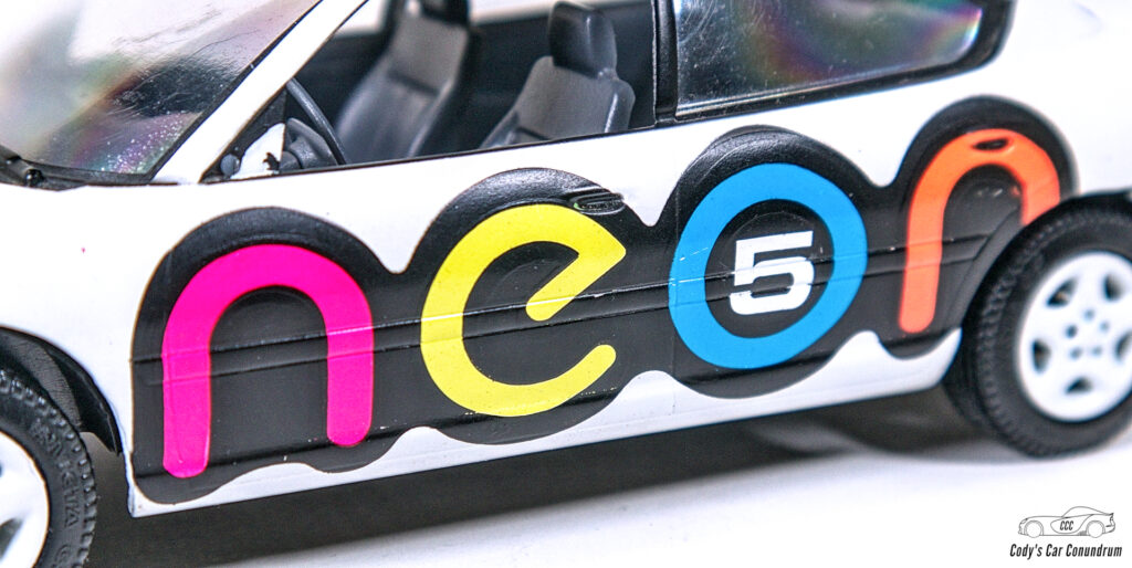 Closeup of "NEON" racing text on Brookfield Dodge Neon model
