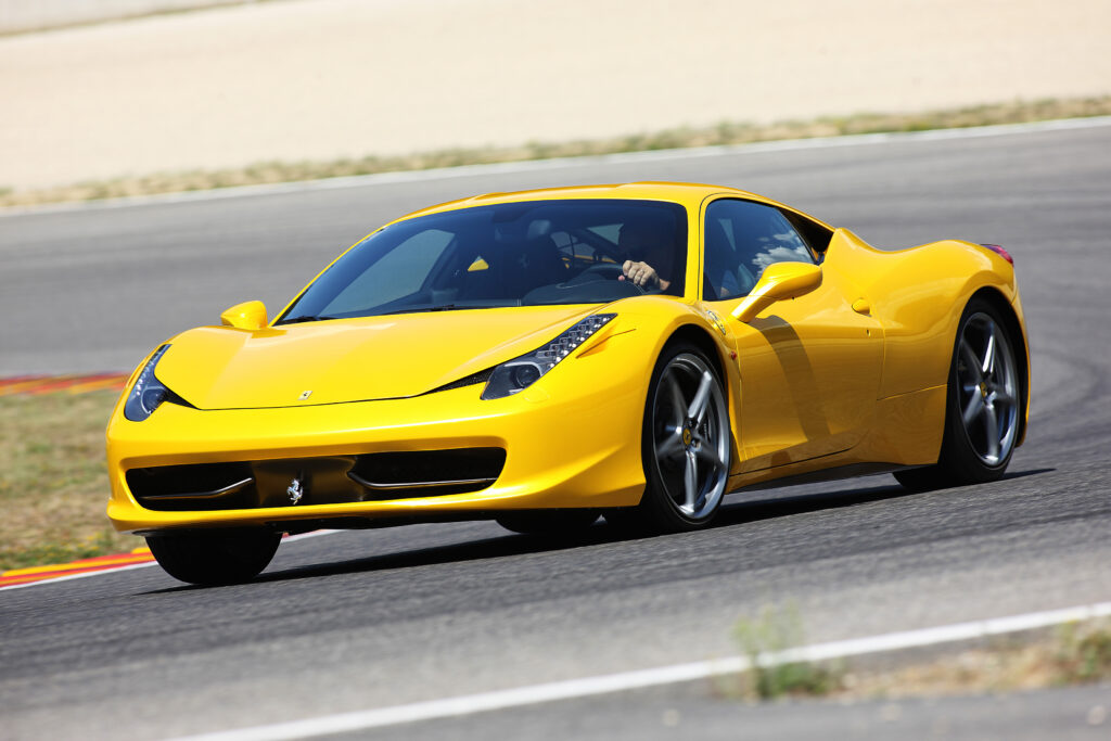 Yellow Ferrari 458 Italia taking a corner